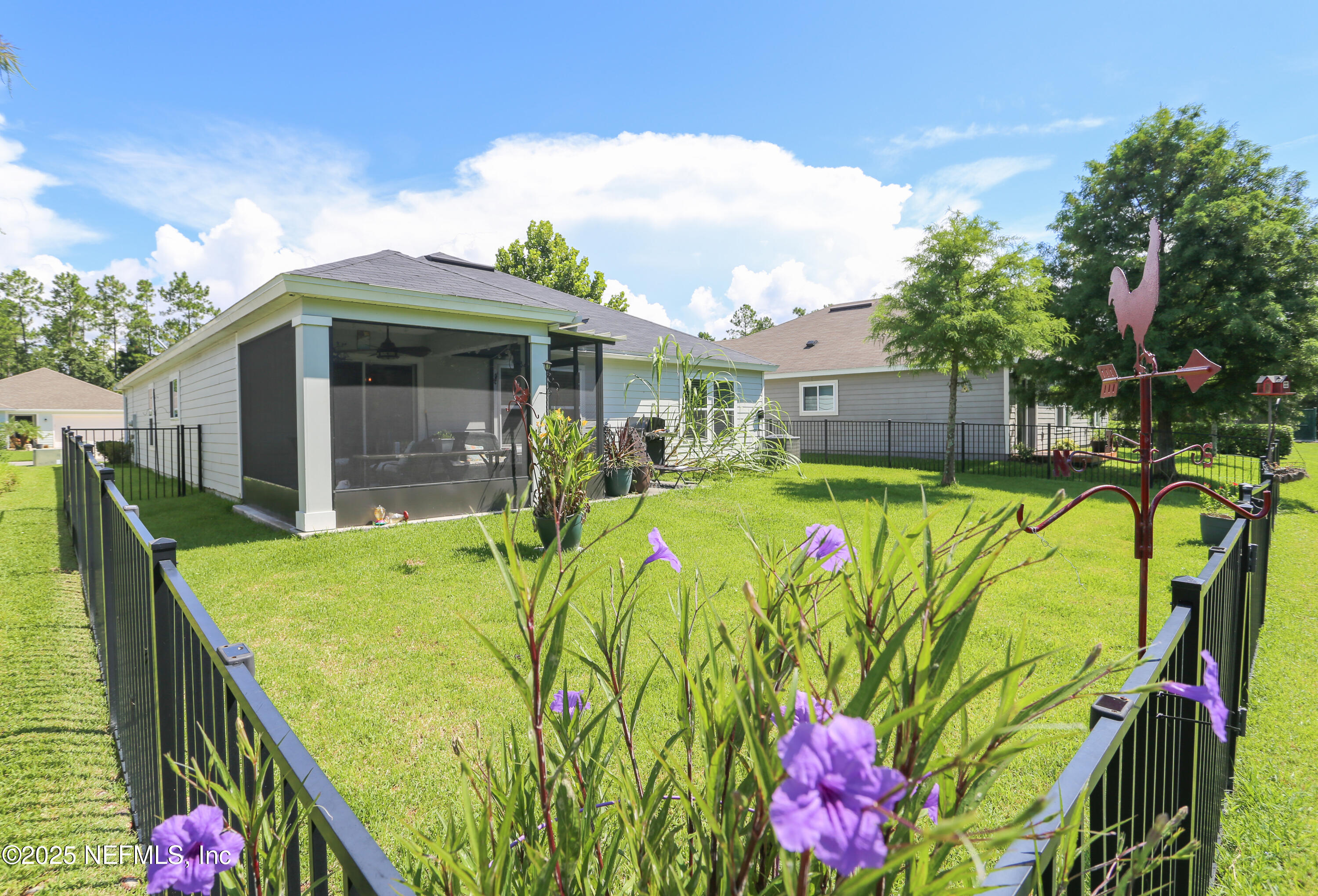 282 Orient Drive St. Augustine, FL 32092 - Photo 6 of 26 Back Elevation with fence and lanai 613
