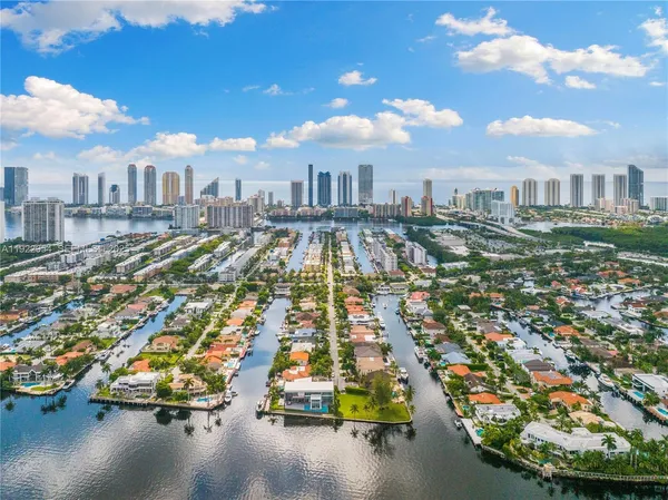 an aerial view of a house with garden space and street view