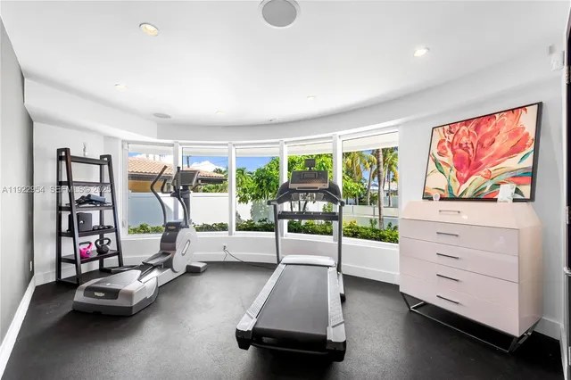 a living room with furniture fireplace and flat screen tv