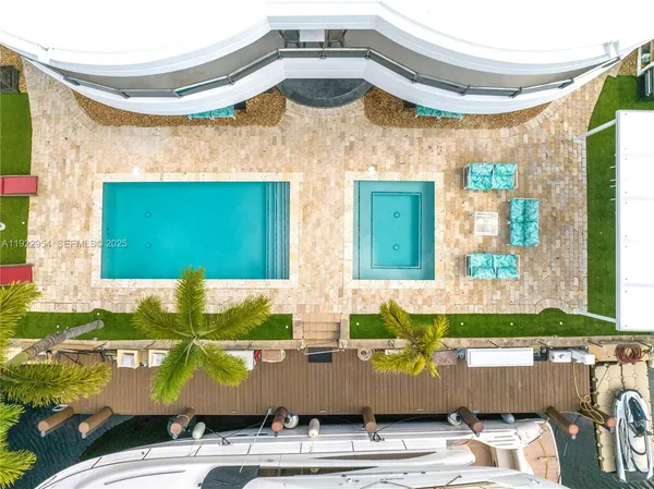 a bedroom with a large bed and a large window