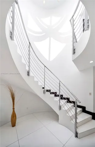 a bedroom with a bed window and walk in closet