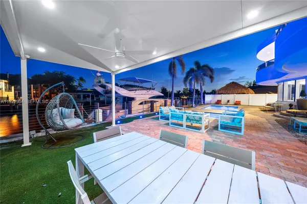 a large kitchen with stainless steel appliances kitchen island granite countertop a large counter top a stove and a sink