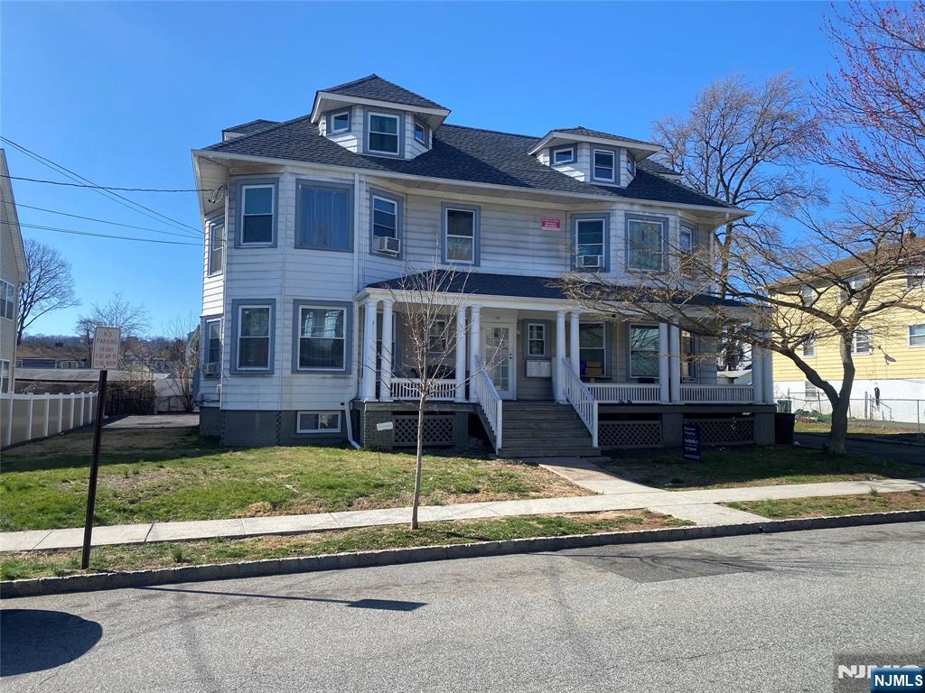 29 High Street, Unit 1R West Orange, NJ 07052 - Photo 2 of 19 a front view of a house with a yard