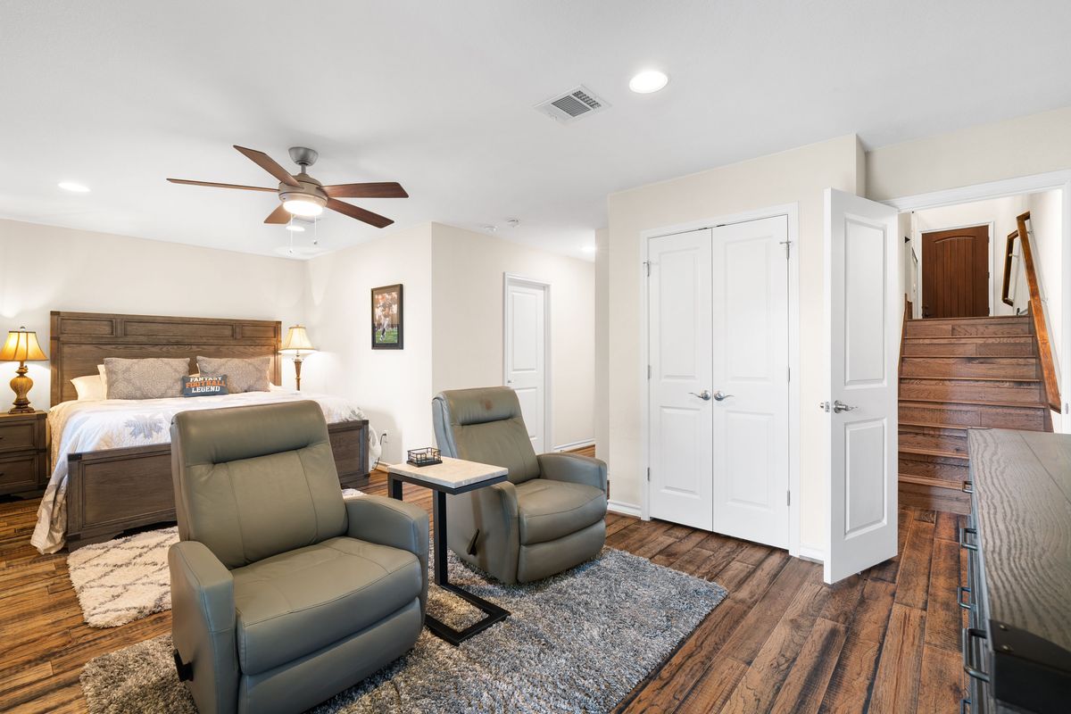 1116 Highknoll Lane Georgetown, TX 78628 - Photo 17 of 36 a bedroom with furniture and wooden floor
