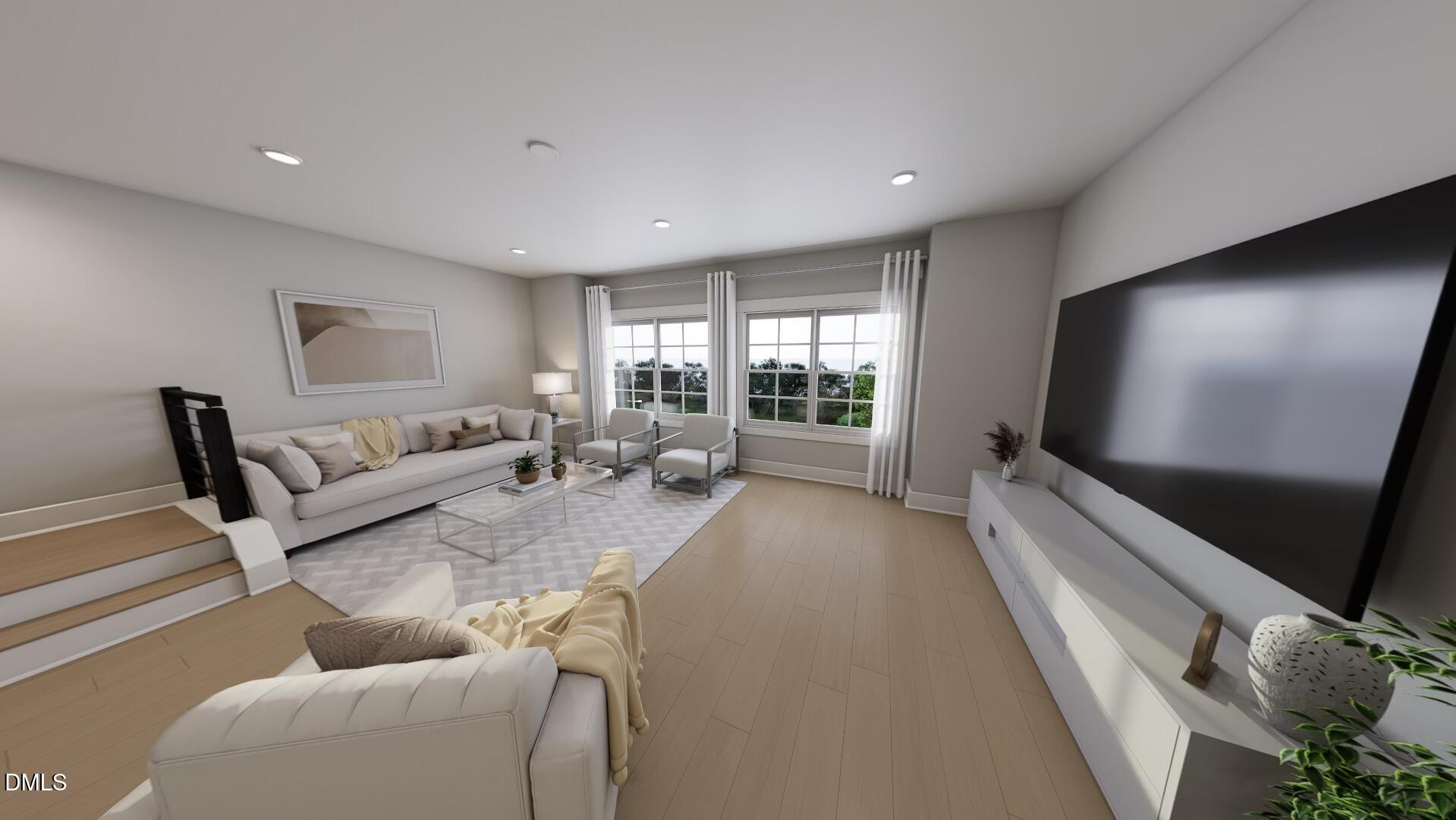 2411 Adrift Road Fuquay-Varina, NC 27526 - Photo 11 of 37 a living room with furniture and a flat screen tv