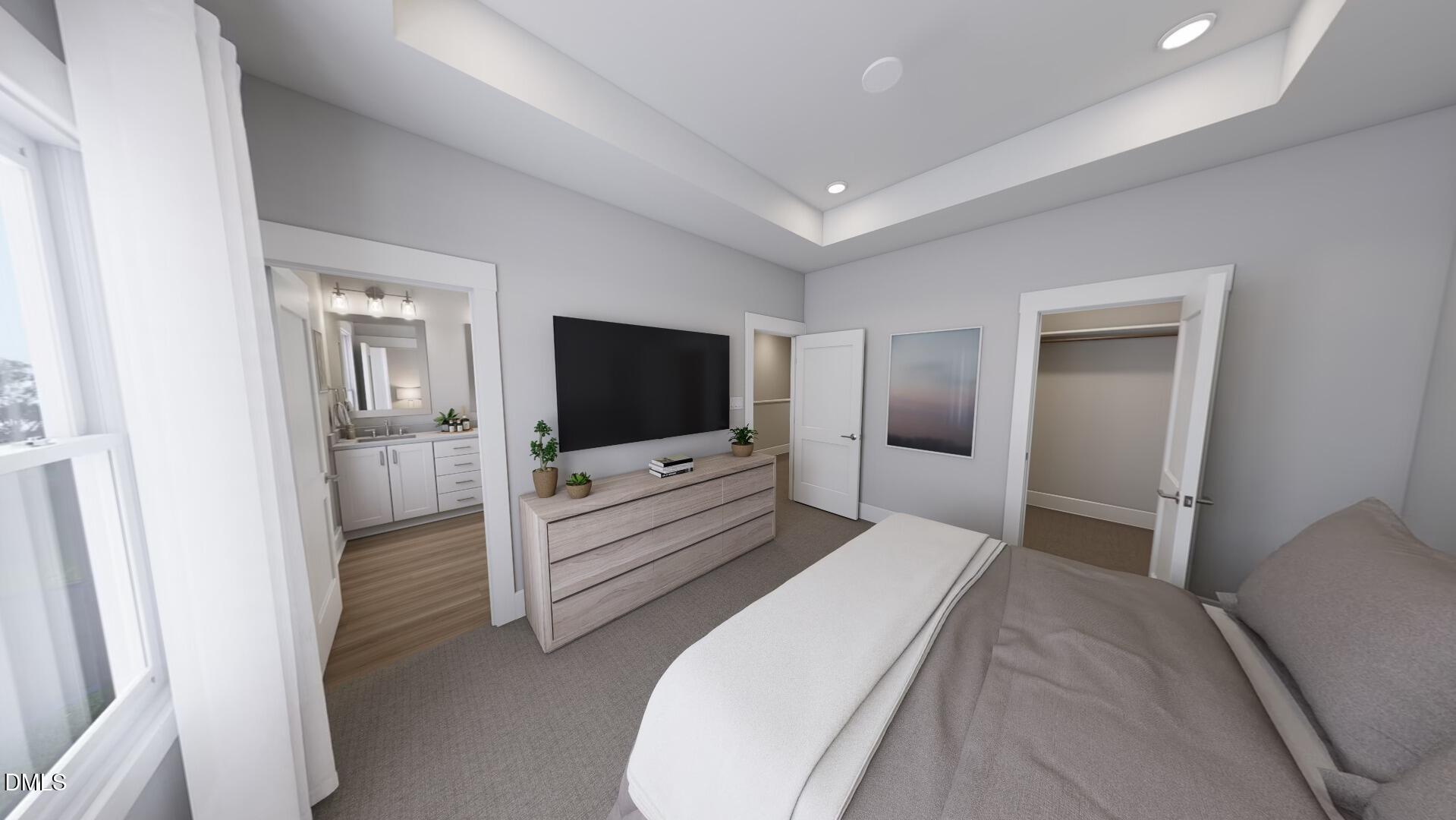 2411 Adrift Road Fuquay-Varina, NC 27526 - Photo 14 of 37 a bedroom with a bed and a flat screen tv