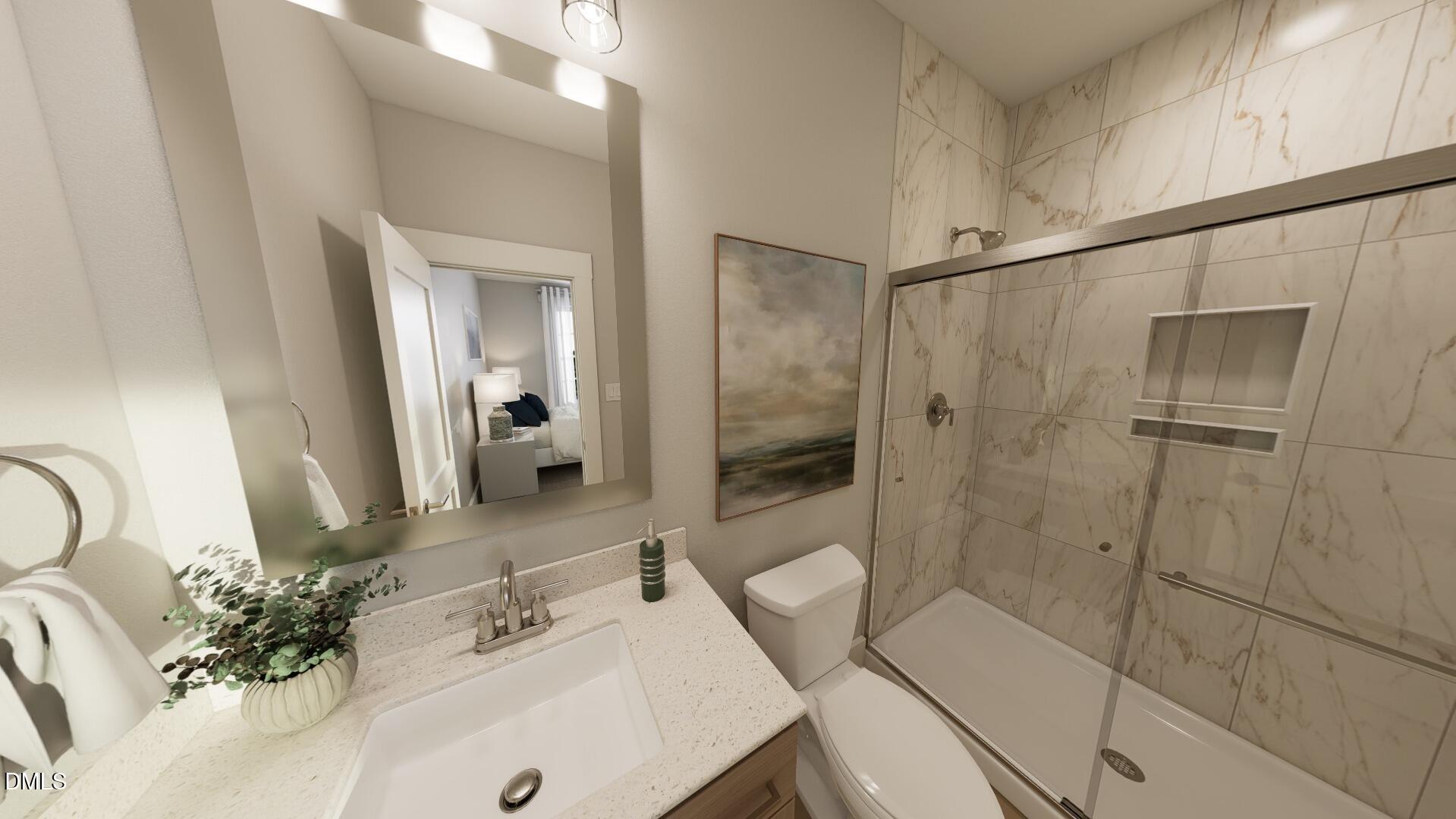 2411 Adrift Road Fuquay-Varina, NC 27526 - Photo 17 of 37 a bathroom with a sink shower and a mirror