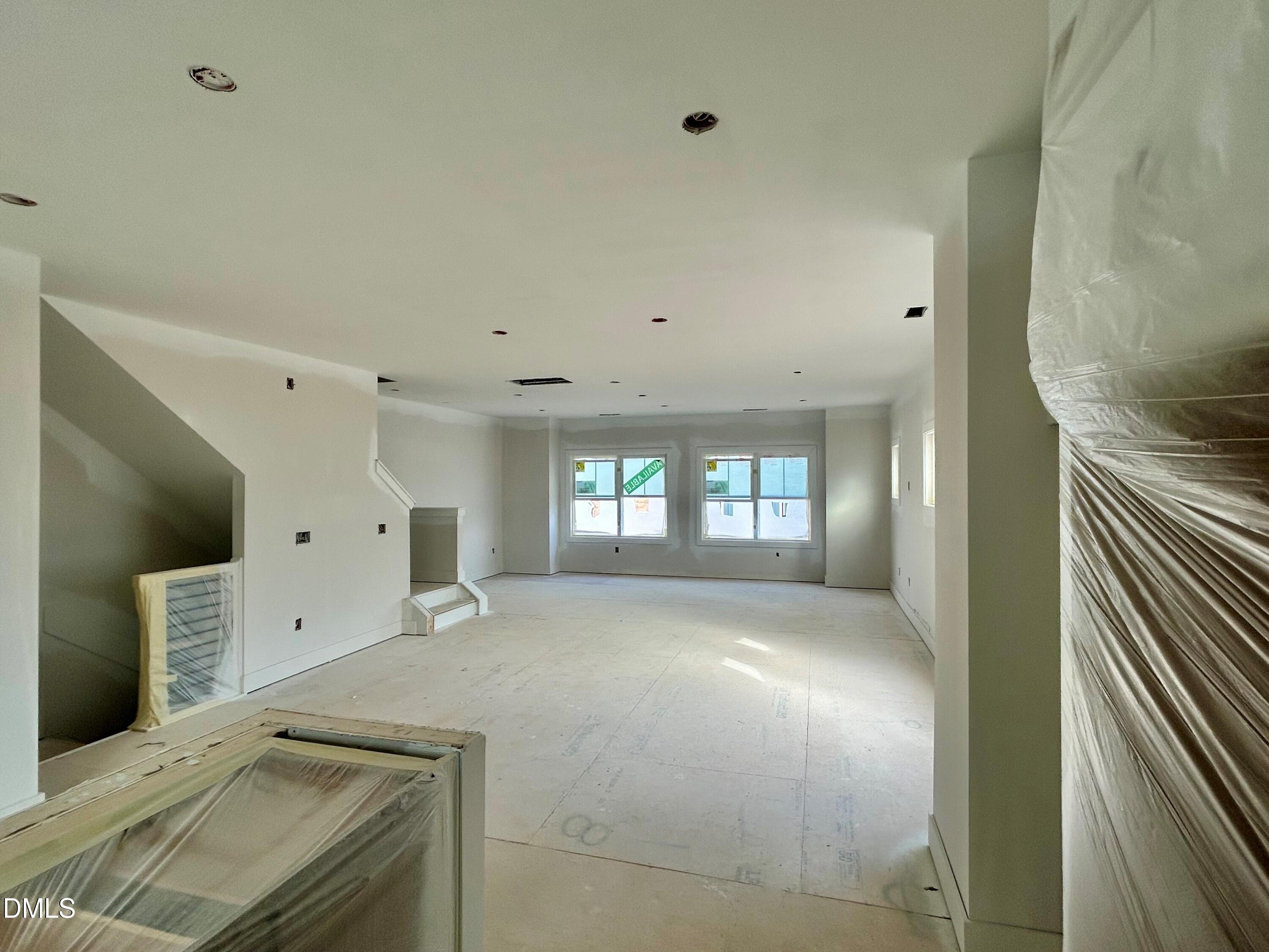 2411 Adrift Road Fuquay-Varina, NC 27526 - Photo 3 of 37 a view of an empty room with glass door and a window