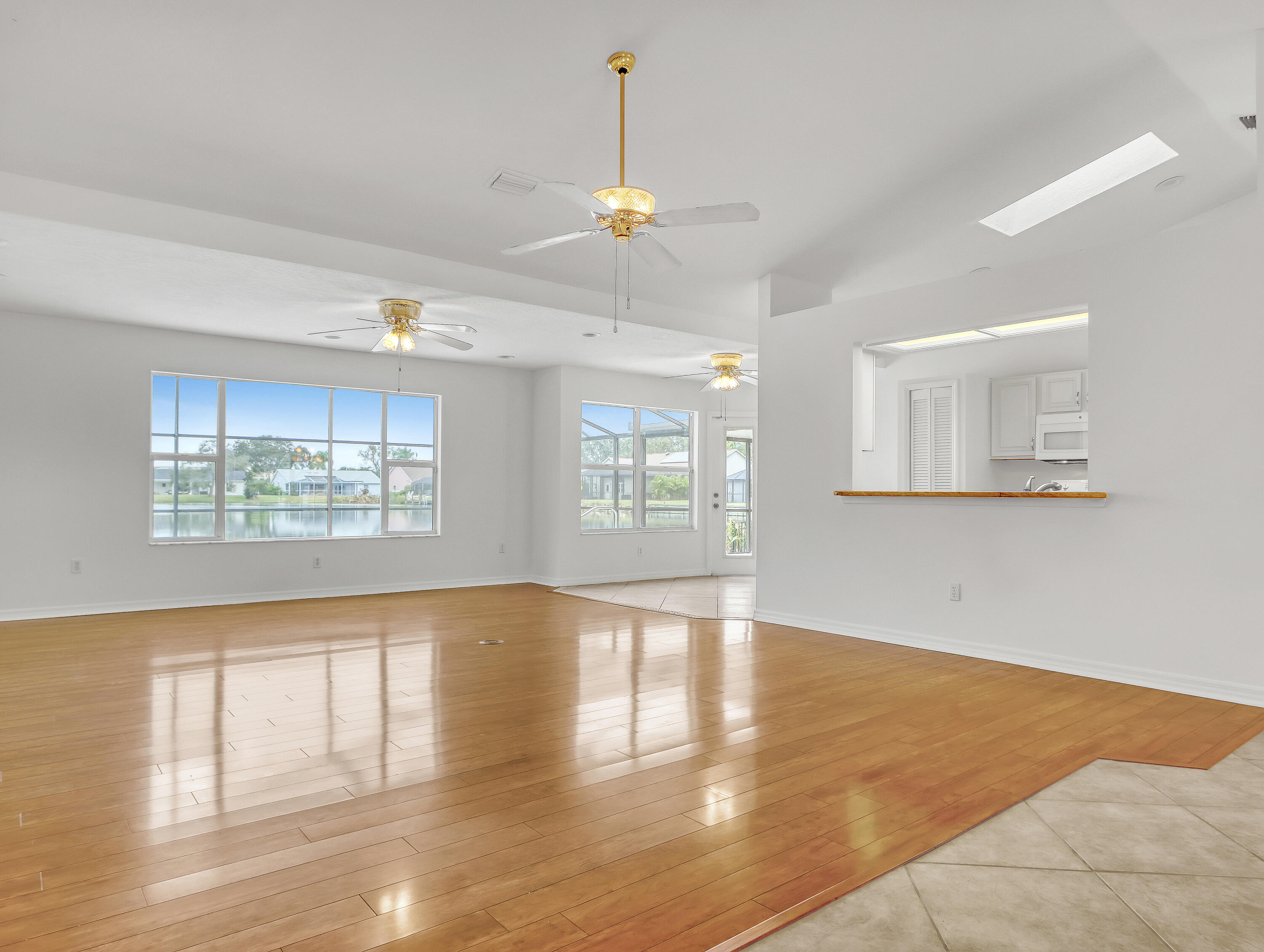 920 Turtle Pond Way Melbourne, FL 32940 - Photo 11 of 53 a view of an empty room with window and wooden floor