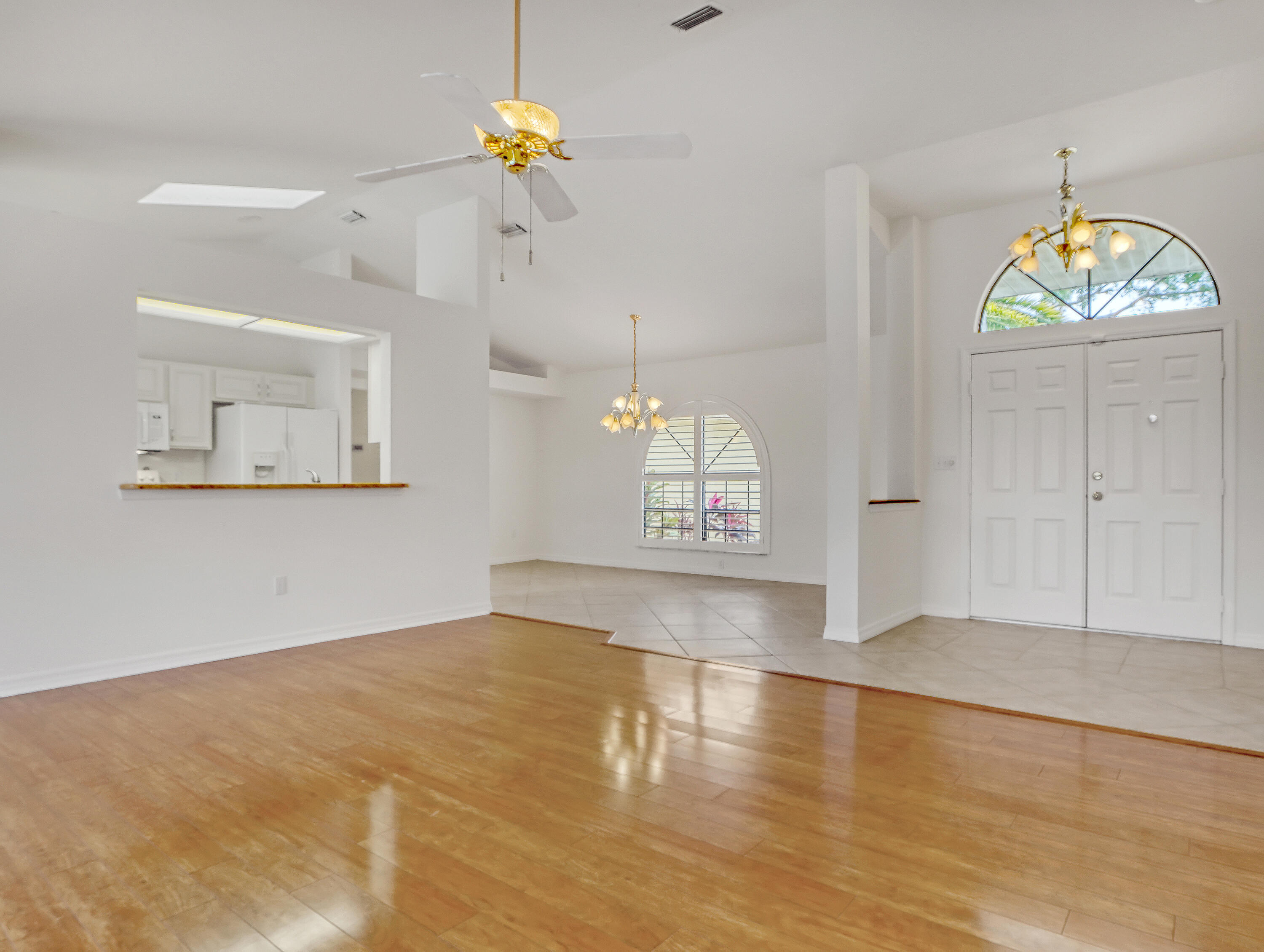 920 Turtle Pond Way Melbourne, FL 32940 - Photo 12 of 53 wooden floor in an empty room with a window