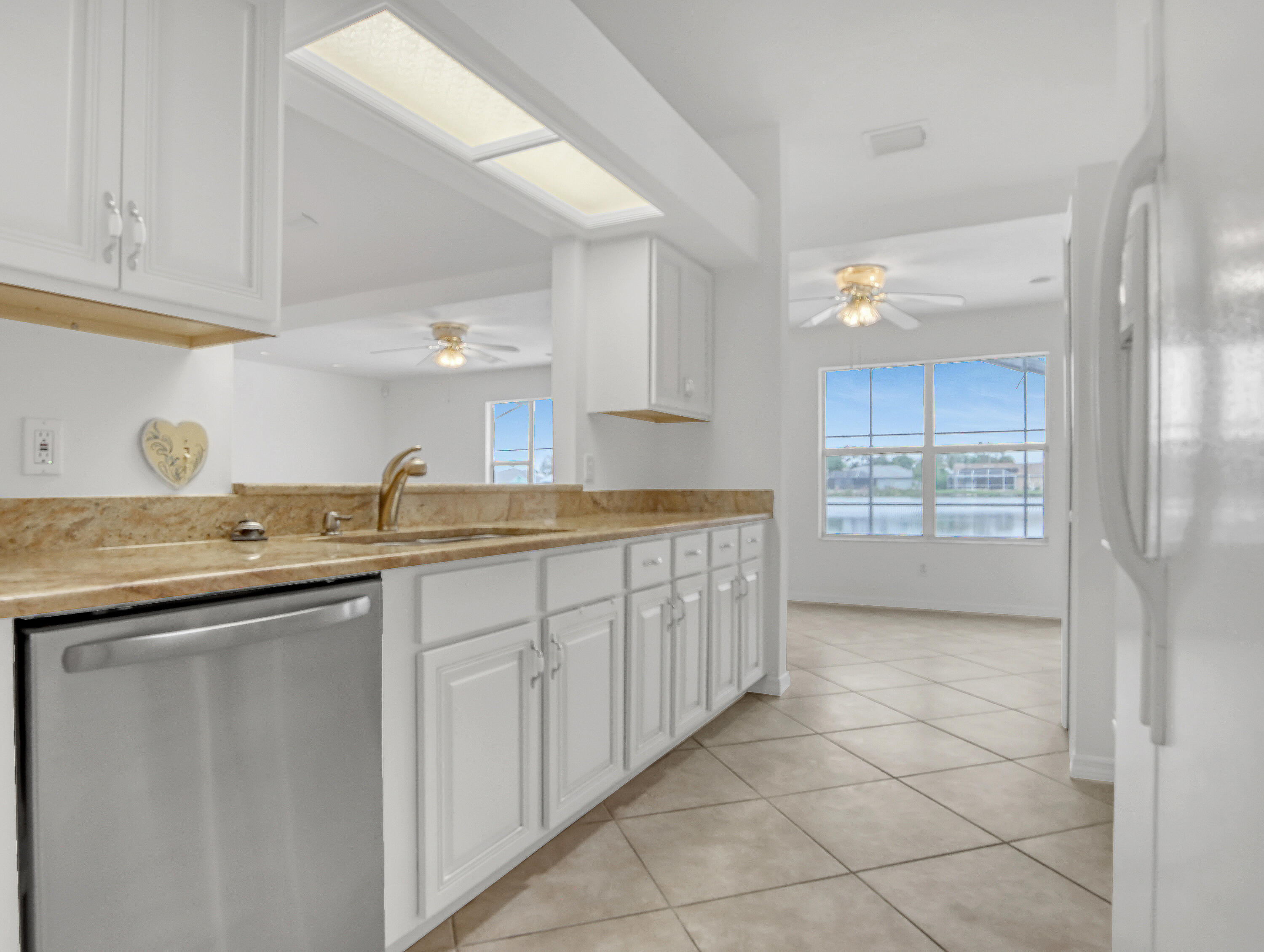 920 Turtle Pond Way Melbourne, FL 32940 - Photo 18 of 53 a kitchen with granite countertop a sink and cabinets