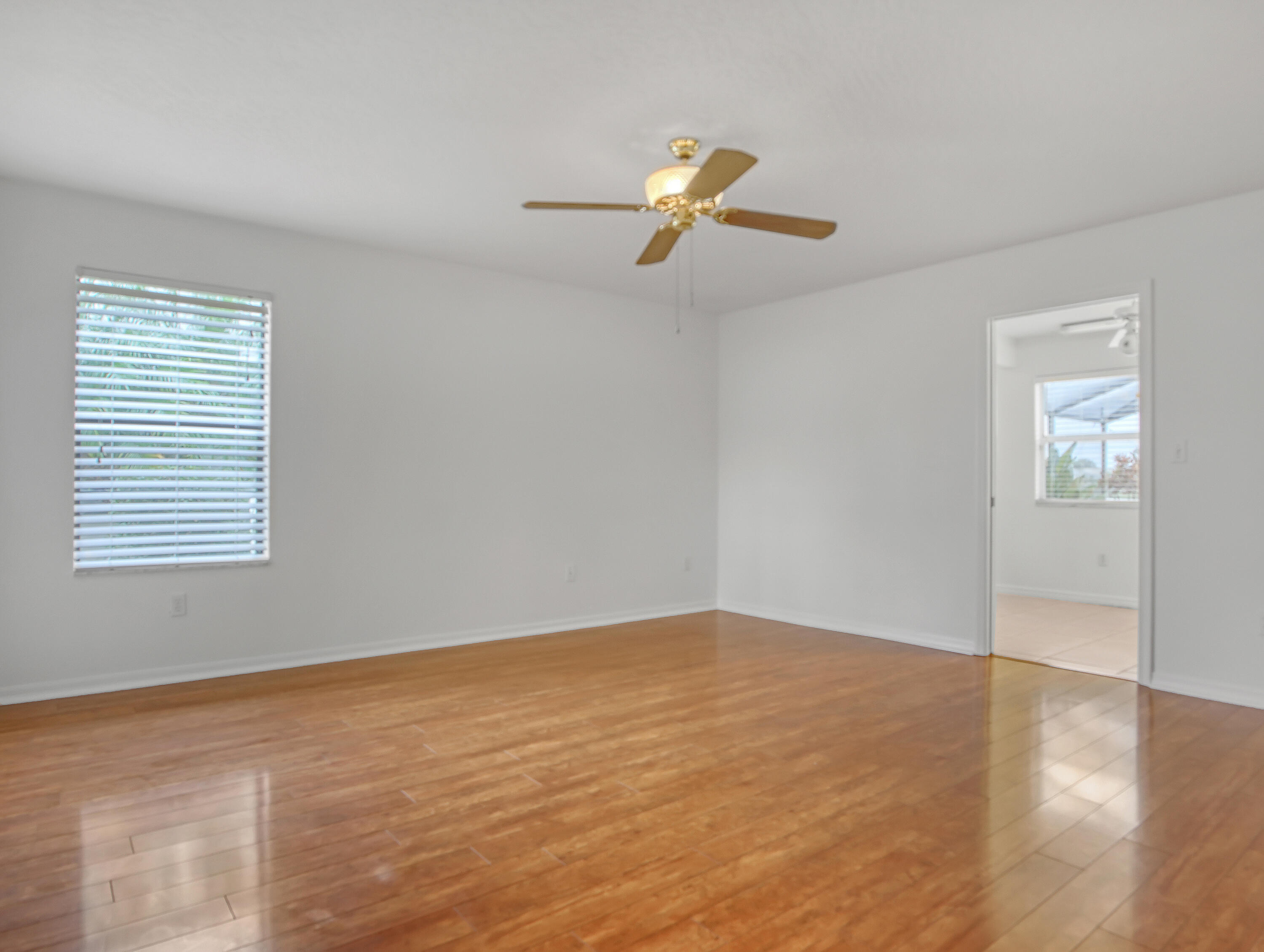920 Turtle Pond Way Melbourne, FL 32940 - Photo 26 of 53 an empty room with windows and fan