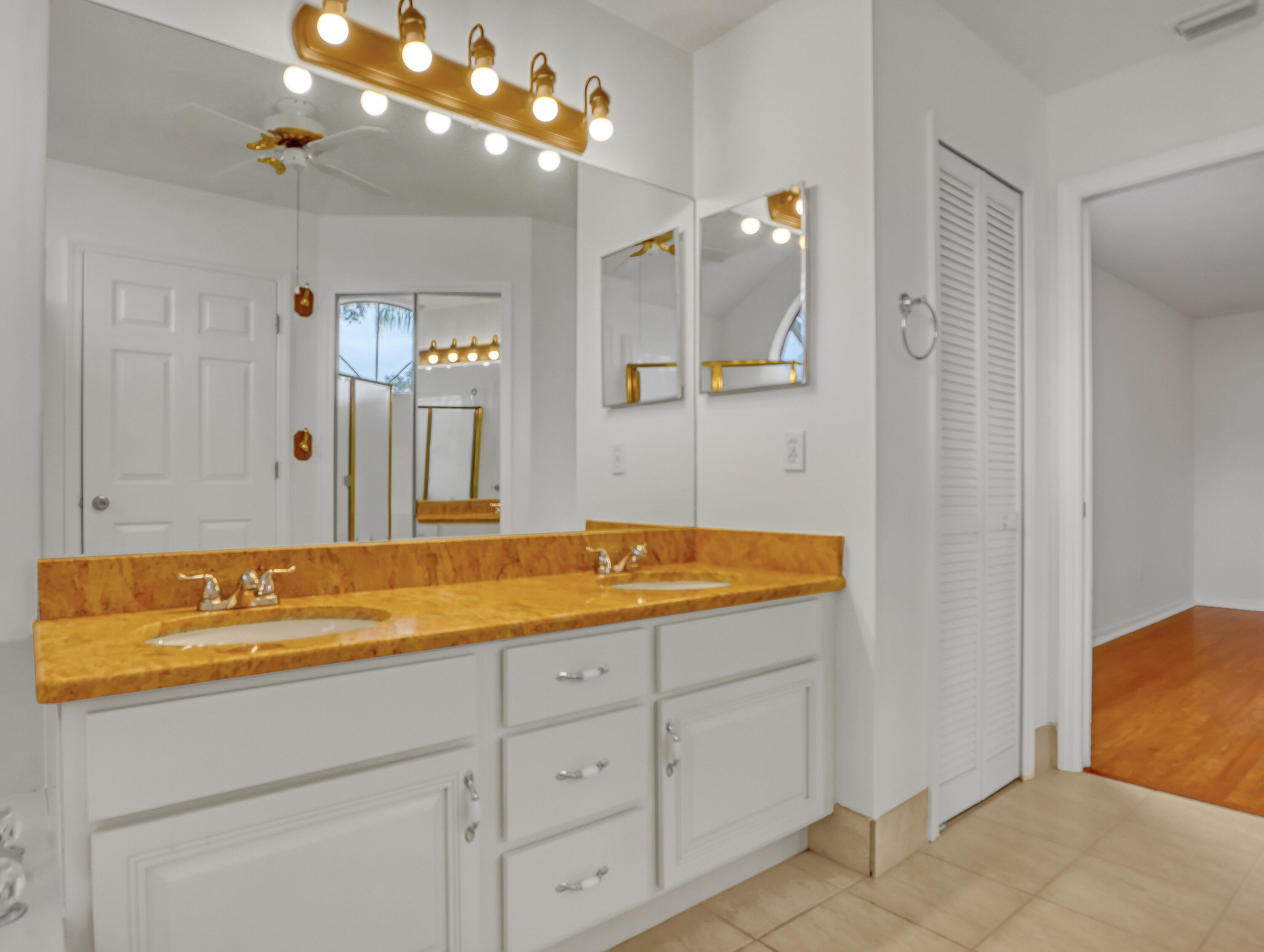 920 Turtle Pond Way Melbourne, FL 32940 - Photo 34 of 53 a spacious bathroom with a granite countertop sink a mirror and shower