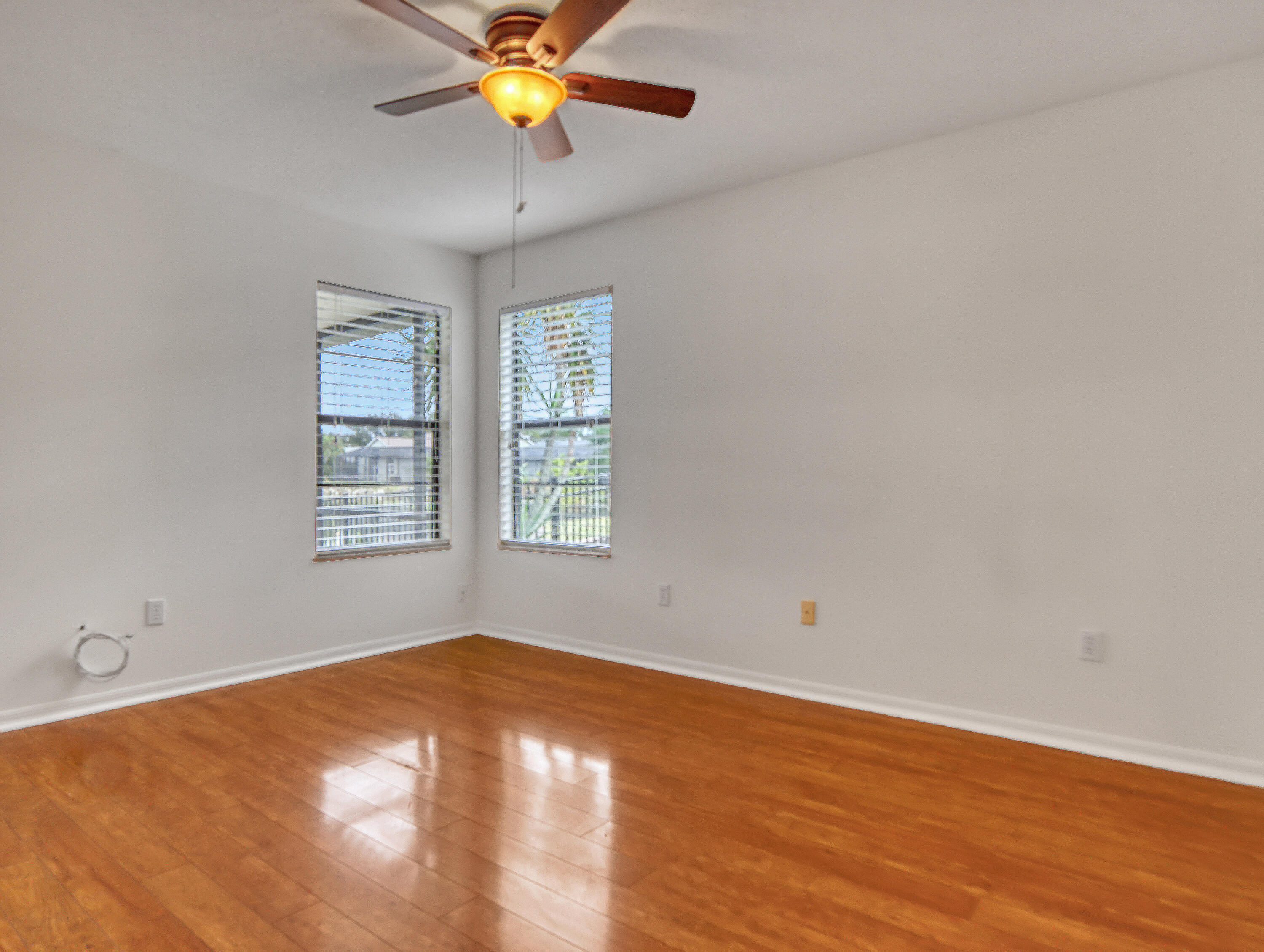 920 Turtle Pond Way Melbourne, FL 32940 - Photo 36 of 53 an empty room with a window and a ceiling fan