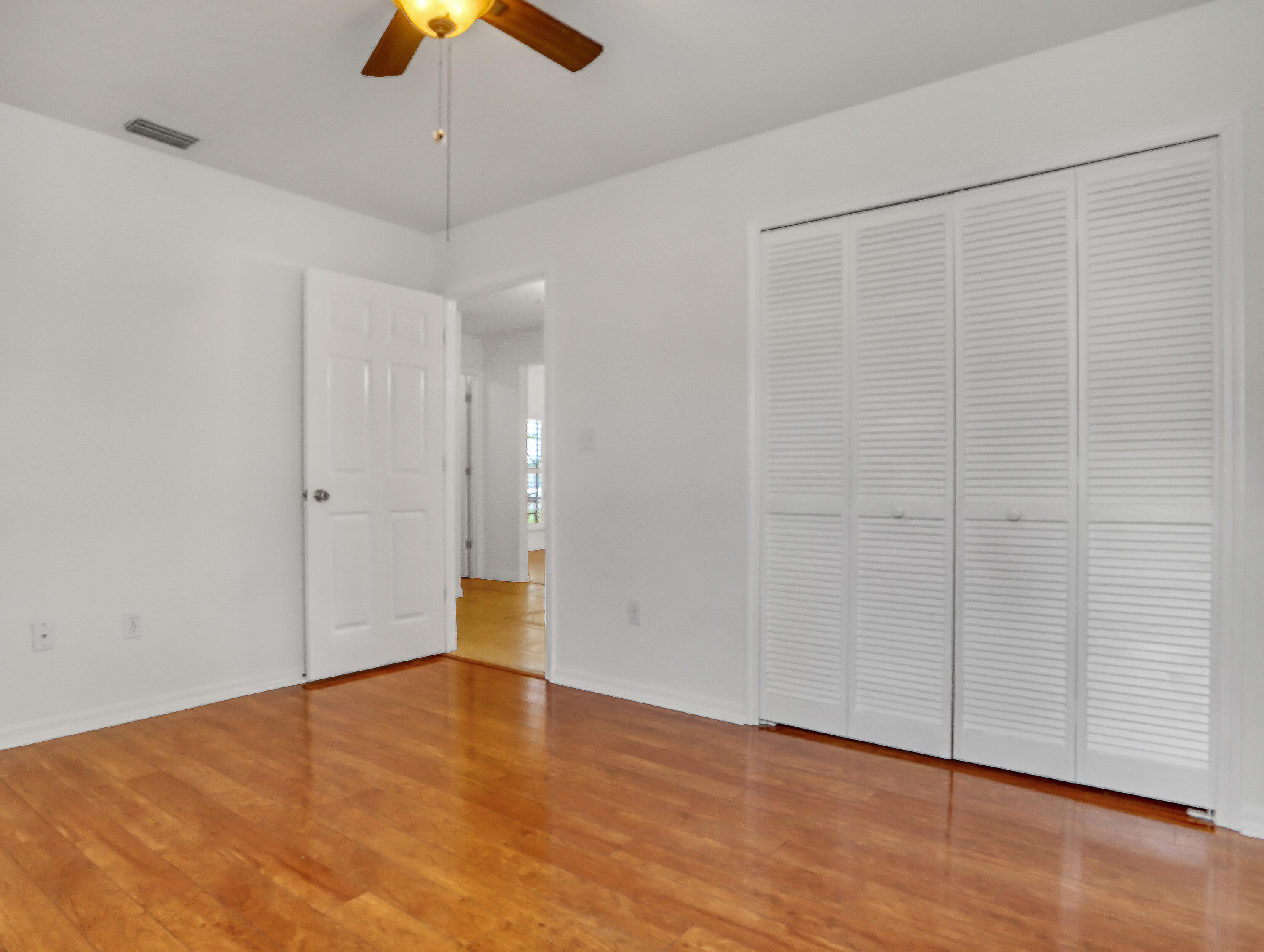 920 Turtle Pond Way Melbourne, FL 32940 - Photo 37 of 53 wooden floor in an empty room with a window
