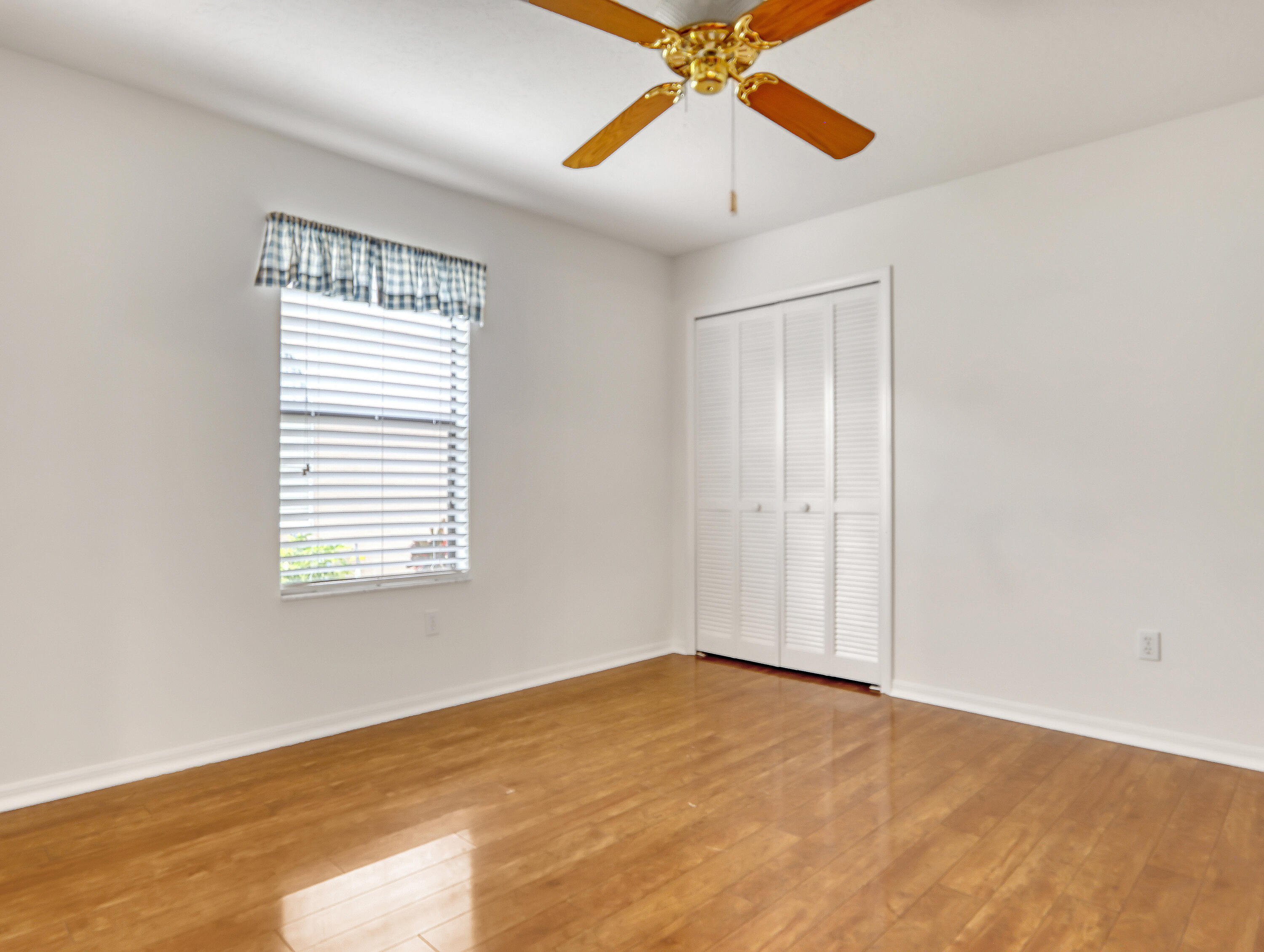 920 Turtle Pond Way Melbourne, FL 32940 - Photo 39 of 53 wooden floor in an empty room with a window