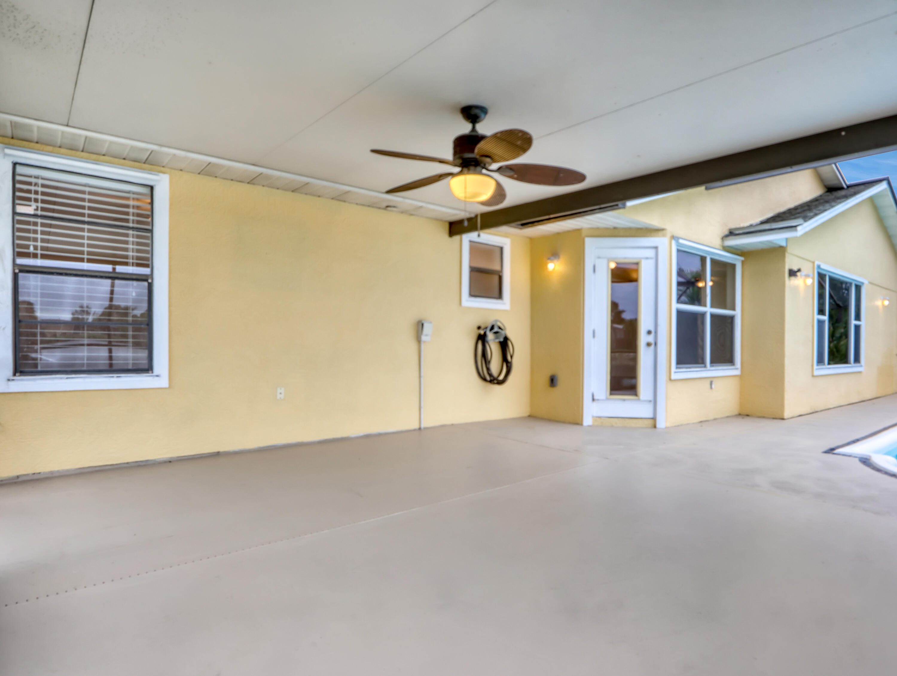 920 Turtle Pond Way Melbourne, FL 32940 - Photo 42 of 53 a view of a livingroom with a ceiling fan and window