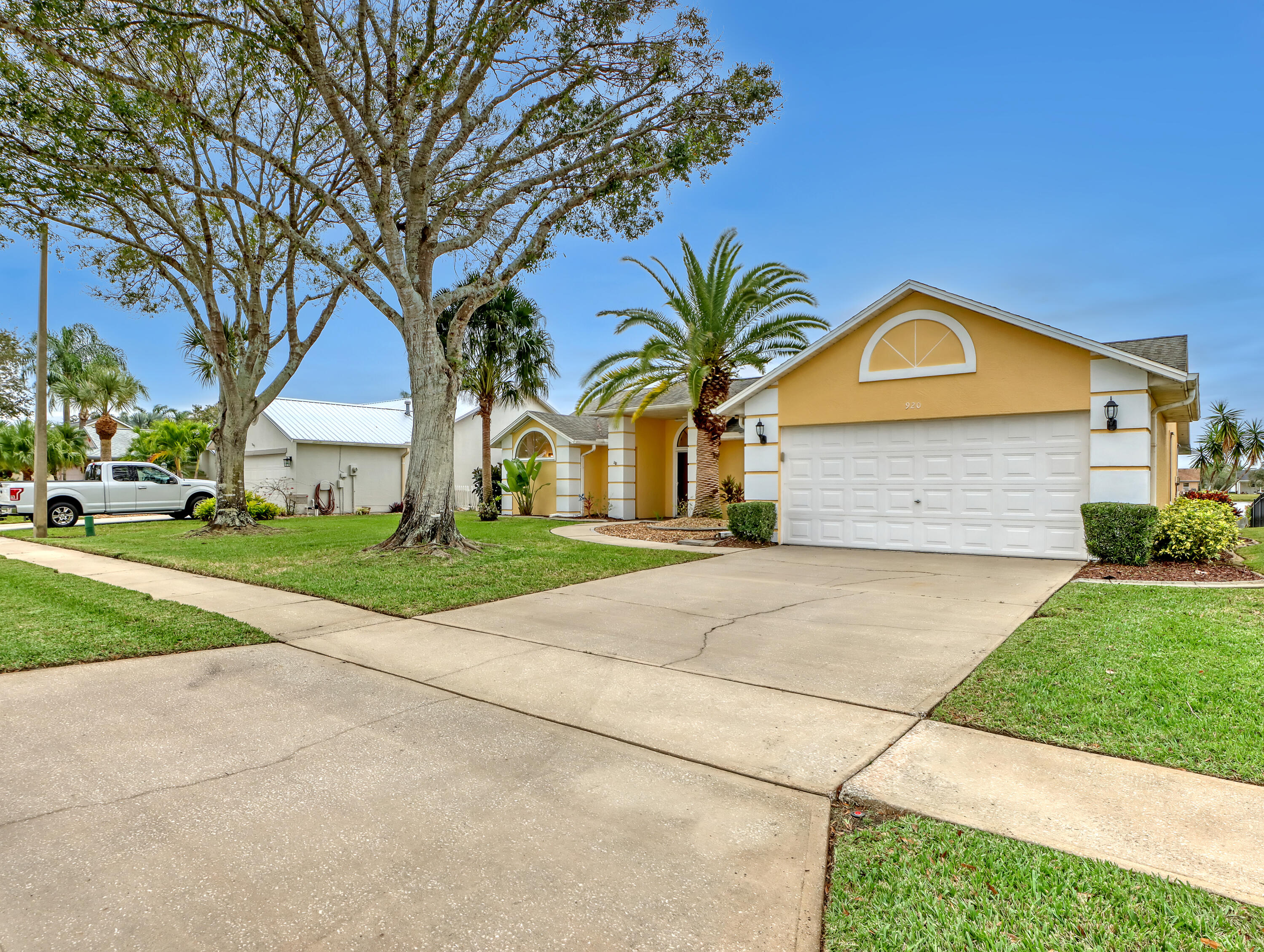 920 Turtle Pond Way Melbourne, FL 32940 - Photo 6 of 53 a front view of a house with a yard and garage