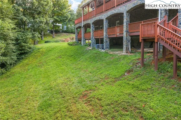 a view of an apartment with a garden and pathway