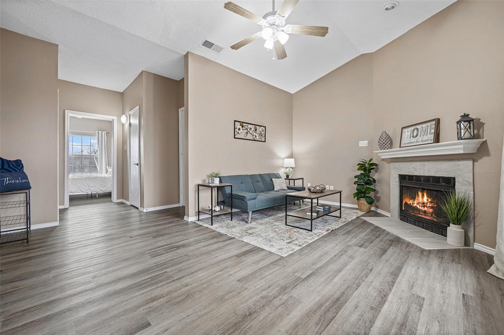 4113 Esters Road, Unit 609 Irving, TX 75038 - Photo 8 of 18 a living room with furniture and a fireplace
