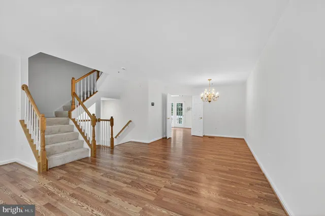 a view of an entryway with wooden floor