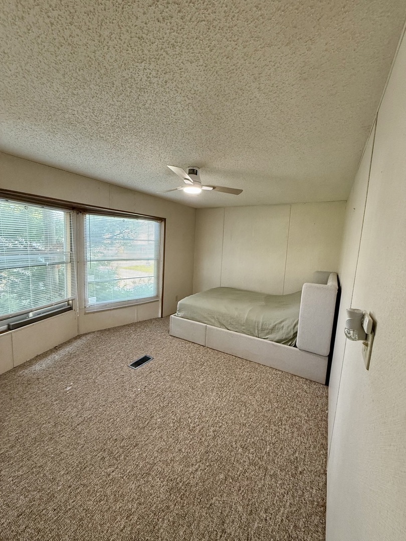23 Walnut Street Minooka, IL 60447 - Photo 14 of 17 a living room with furniture and a large window