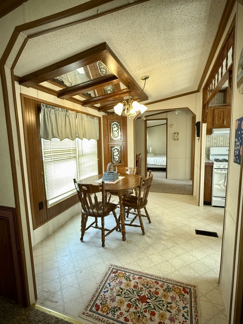 23 Walnut Street Minooka, IL 60447 - Photo 7 of 17 a view of a dining room with furniture window and wooden floor