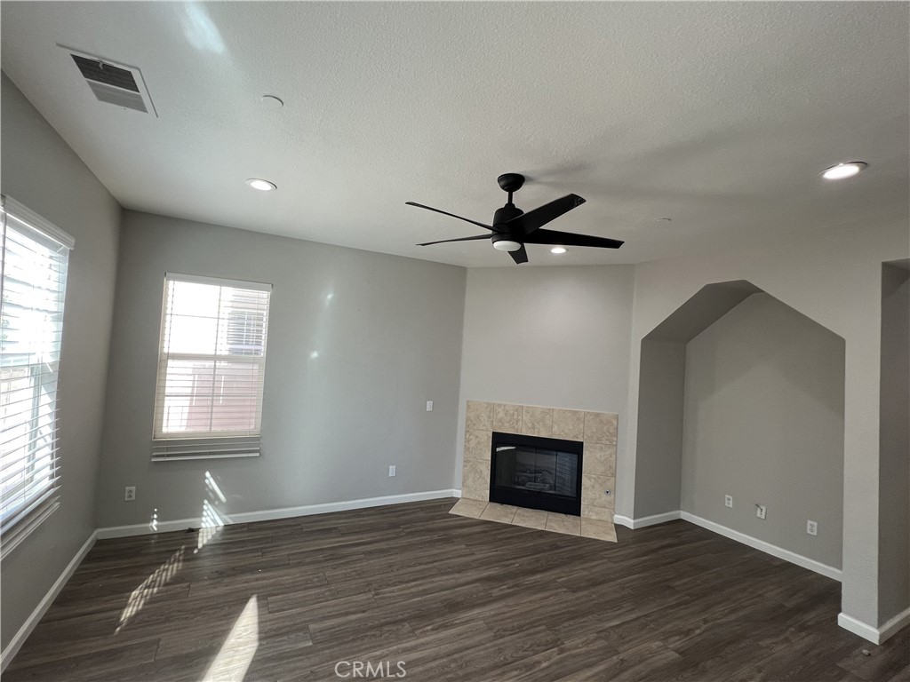1779 Edmon Way Riverside, CA 92501 - Photo 4 of 10 a view of a livingroom with a ceiling fan and window