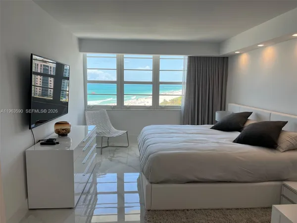 a bathroom with a toilet a sink and shower