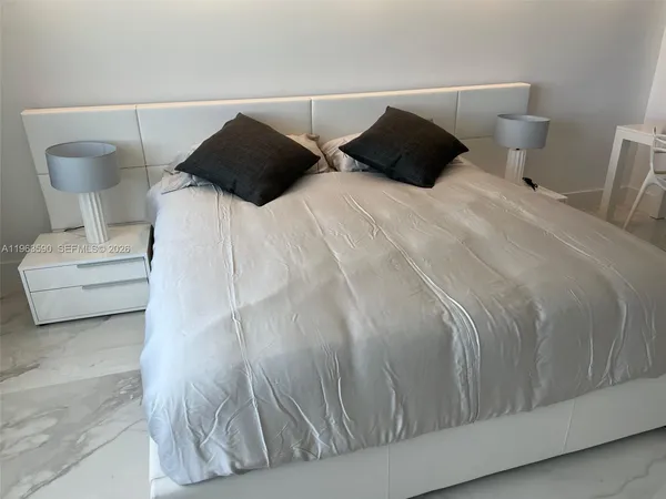 a bathroom with a toilet a a sink and a shower