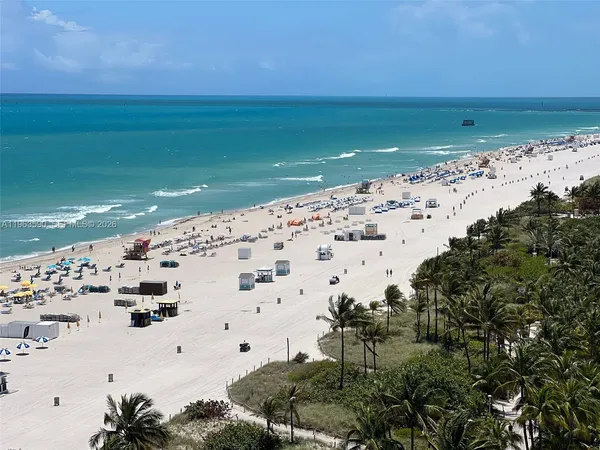 an aerial view of a residential houses with outdoor space