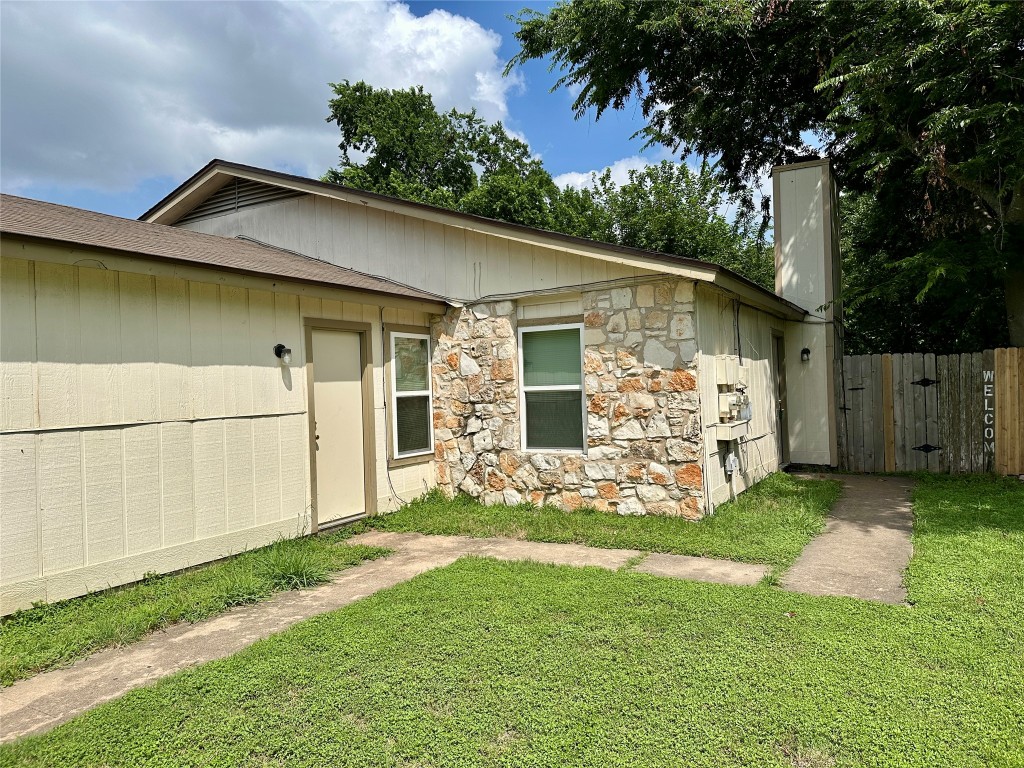 12603 Turtle Rock Road, Unit A Austin, TX 78729 - Photo 1 of 1 a view of a backyard with a small cabin