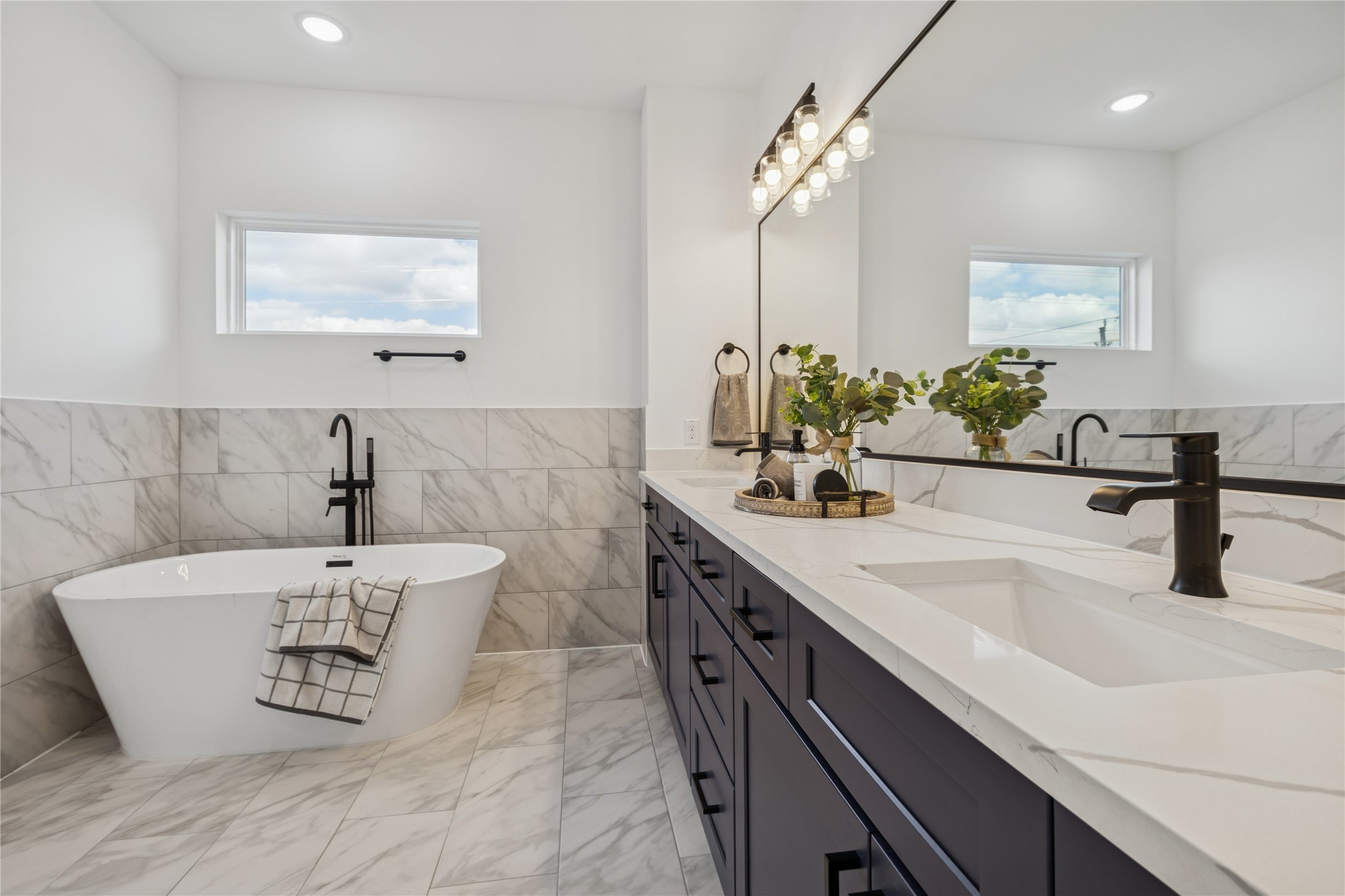 113 Milby Street Houston, TX 77003 - Photo 27 of 38 a bathroom with a sink double vanity and a mirror