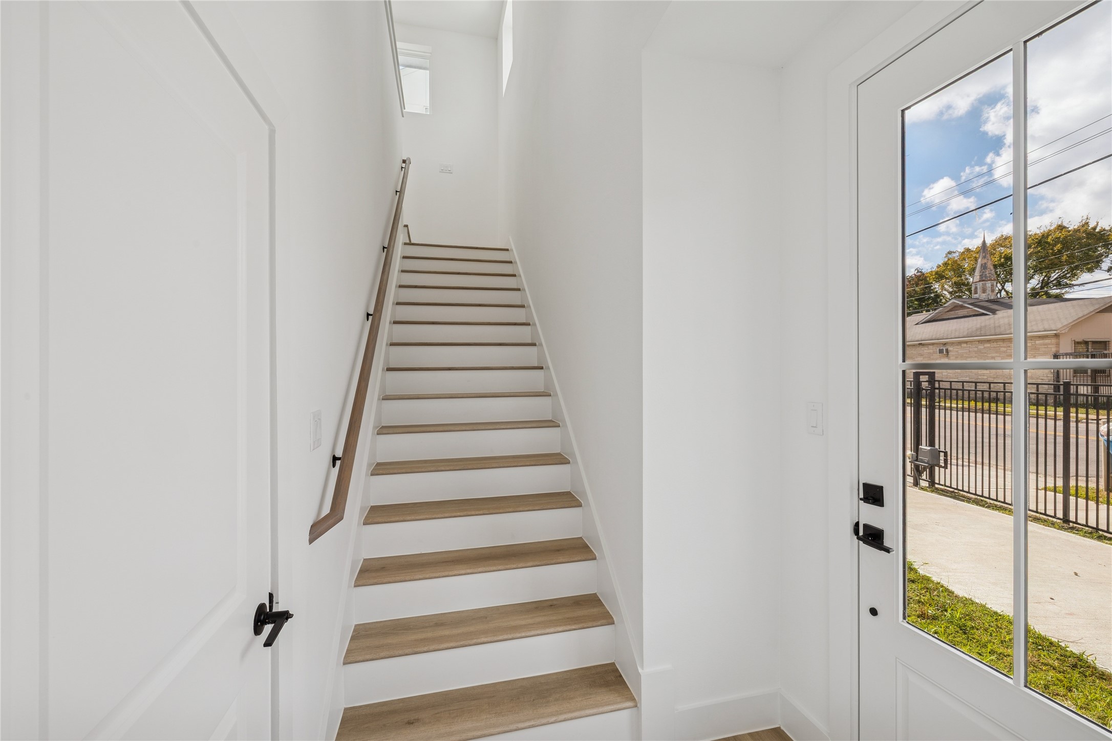 113 Milby Street Houston, TX 77003 - Photo 3 of 38 a view of a hallway with wooden floor and entryway