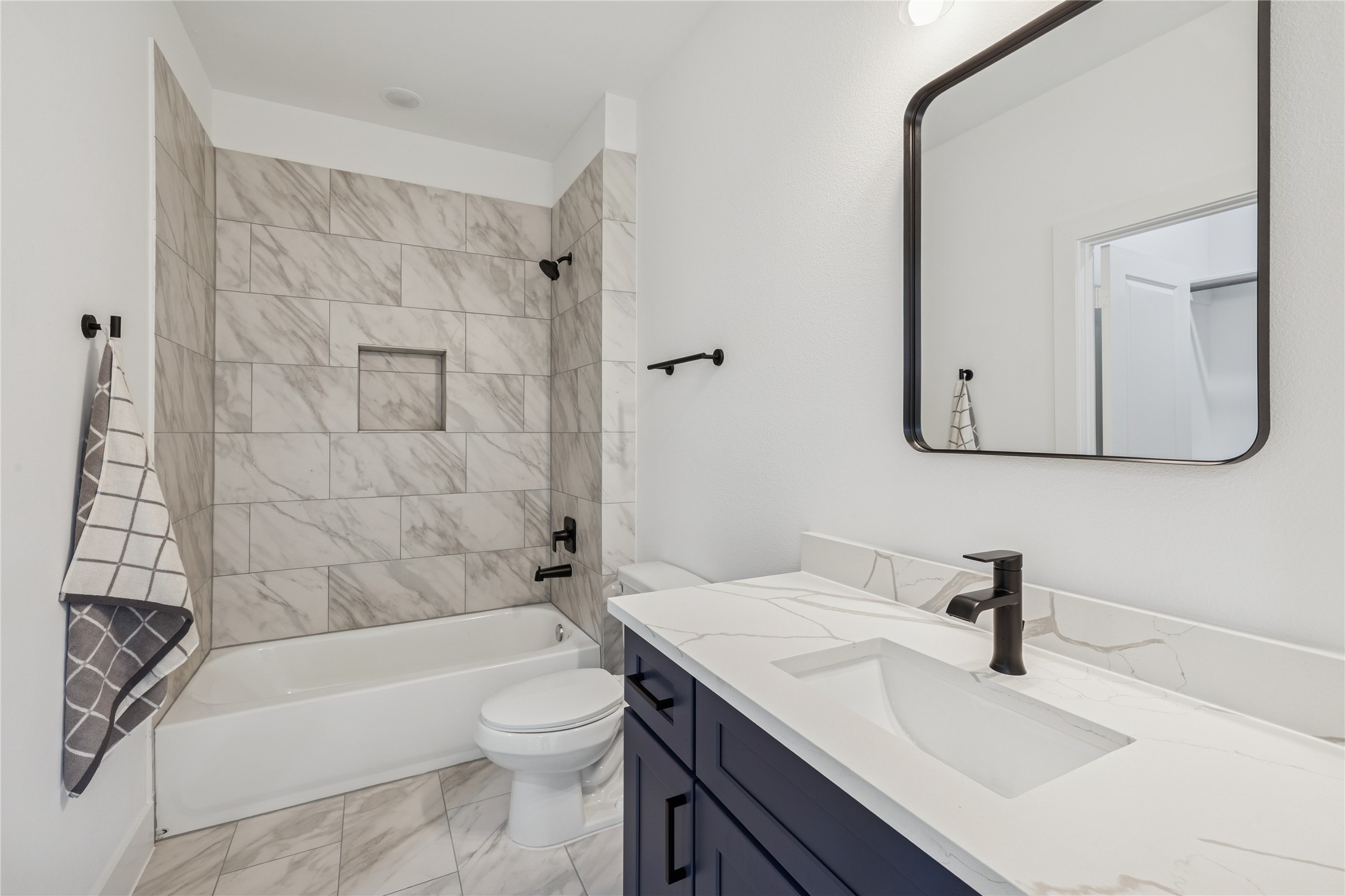 113 Milby Street Houston, TX 77003 - Photo 7 of 38 a bathroom with a sink a toilet and shower