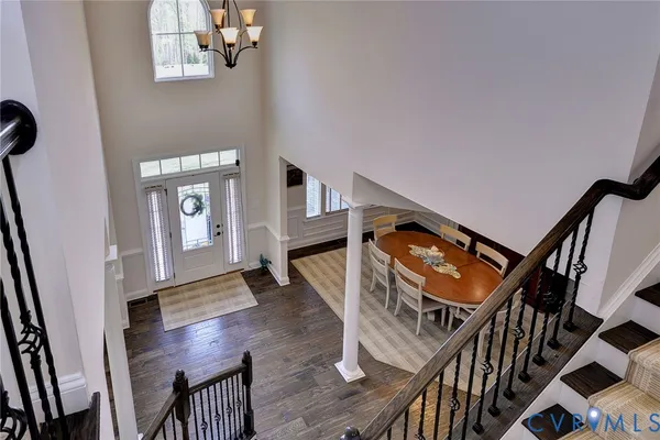 a view of an entryway with wooden floor