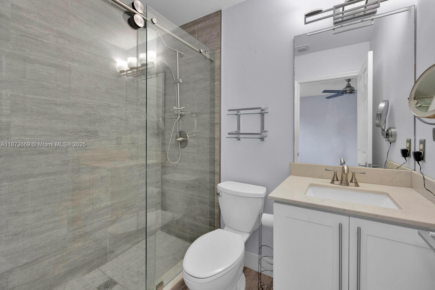 2641 Southwest 83rd Terrace, Unit 104 Miramar, FL 33025 - Photo 20 of 30 a bathroom with a sink toilet and shower