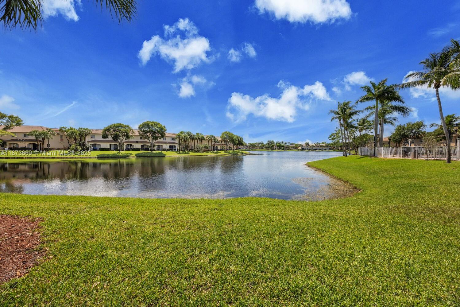 2641 Southwest 83rd Terrace, Unit 104 Miramar, FL 33025 - Photo 27 of 30 a view of a lake with houses in the back