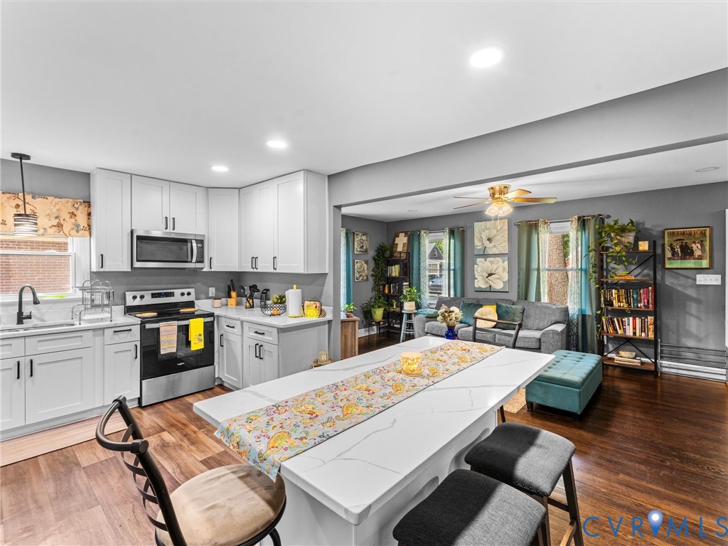 Kitchen with white cabinetry, stainless steel appl