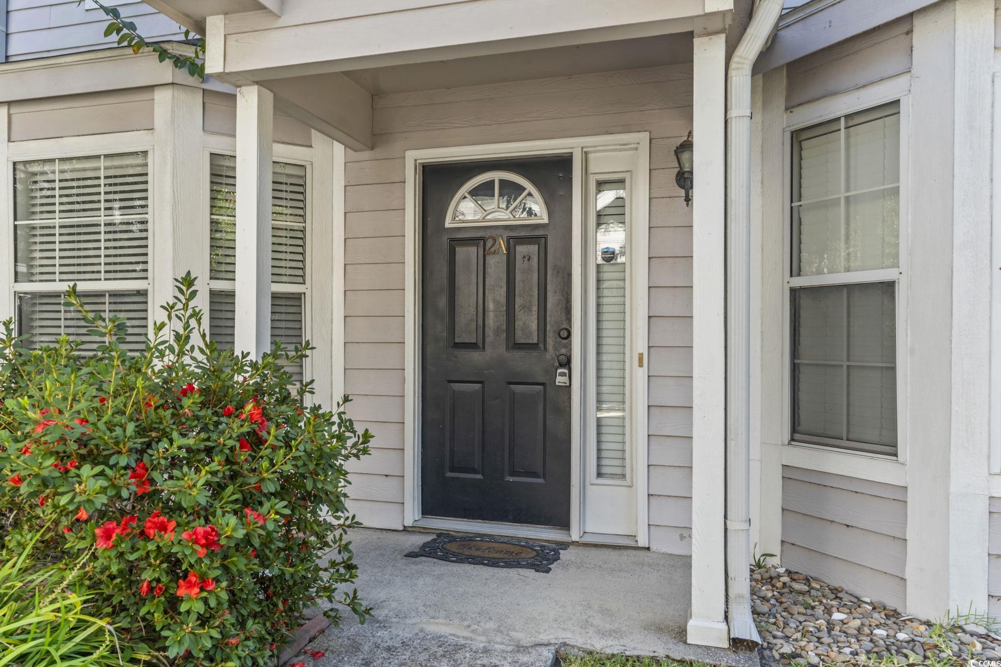 712 67th Avenue North, Unit 2A Myrtle Beach, SC 29572 - Photo 2 of 30 Entrance to property featuring a porch