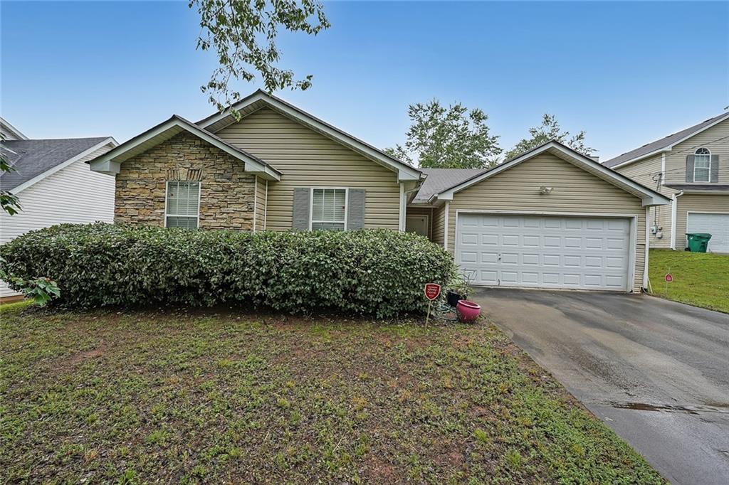 2374 Brandenberry Court Decatur, GA 30034 - Photo 1 of 1 a front view of a house with a yard and garage