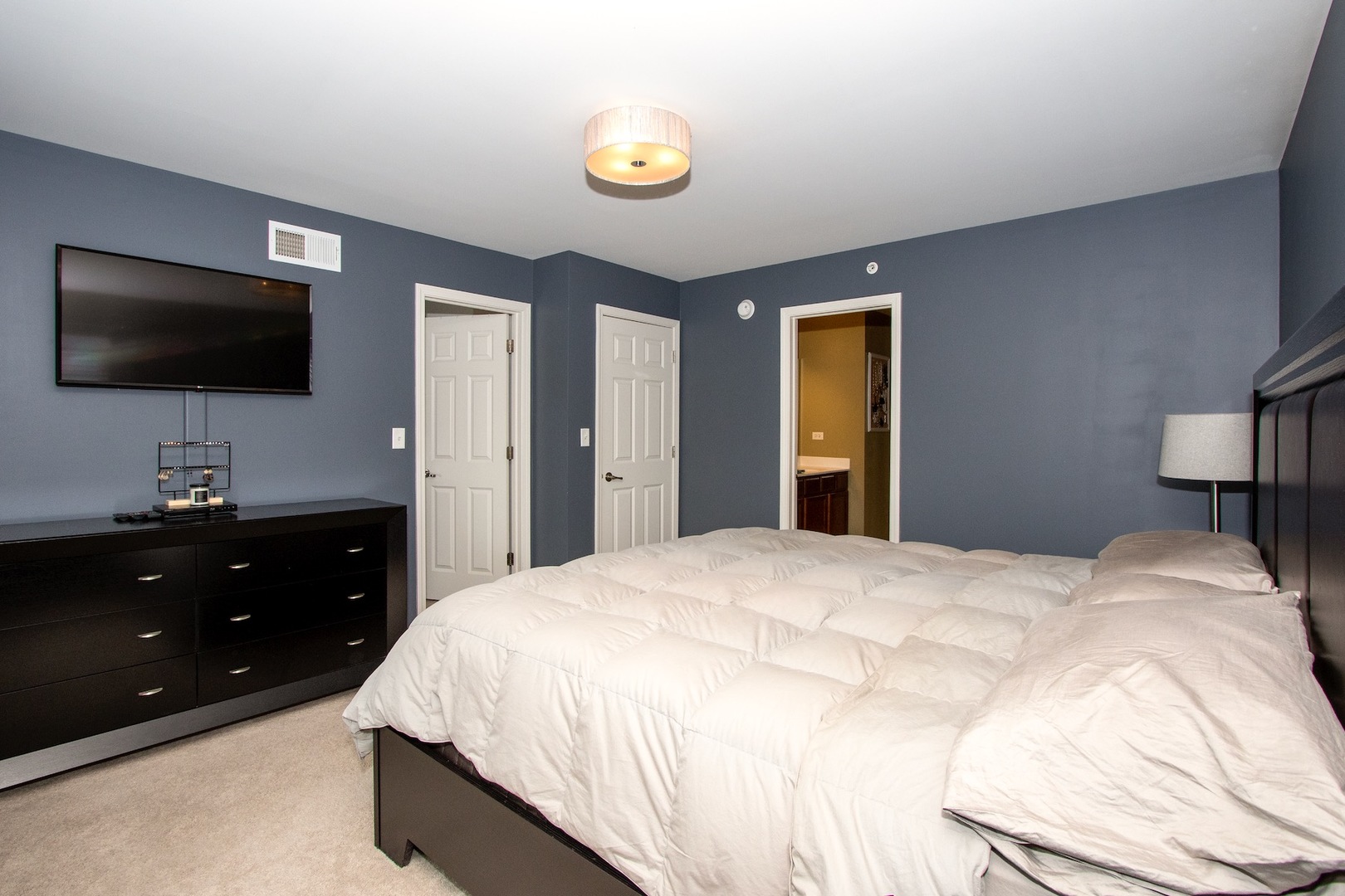 10346 Kerry Ridge Court Chicago Ridge, IL 60415 - Photo 12 of 20 a bedroom with a bed and a flat screen tv