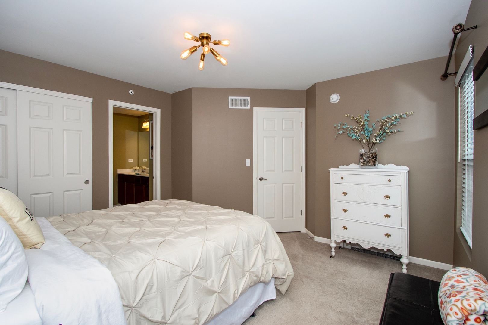 10346 Kerry Ridge Court Chicago Ridge, IL 60415 - Photo 16 of 20 a bedroom with a bed and a chandelier