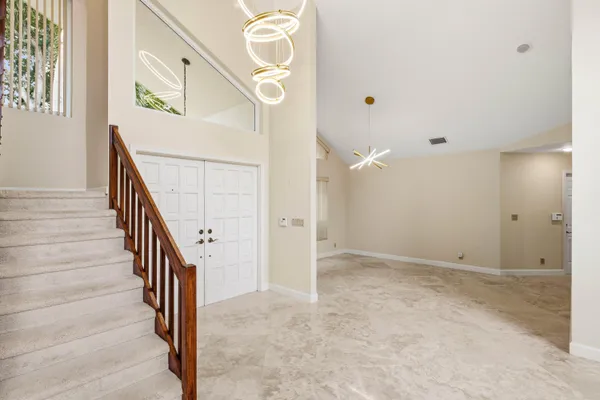 a view of an entryway with wooden floor