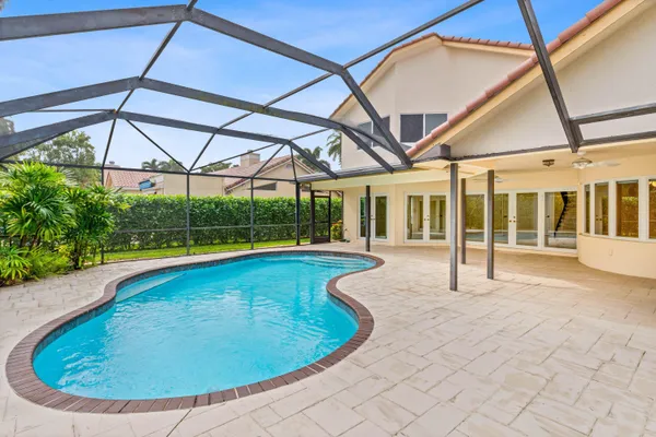 a view of a swimming pool with a lounge chairs