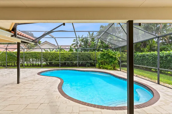 a view of swimming pool with seating area