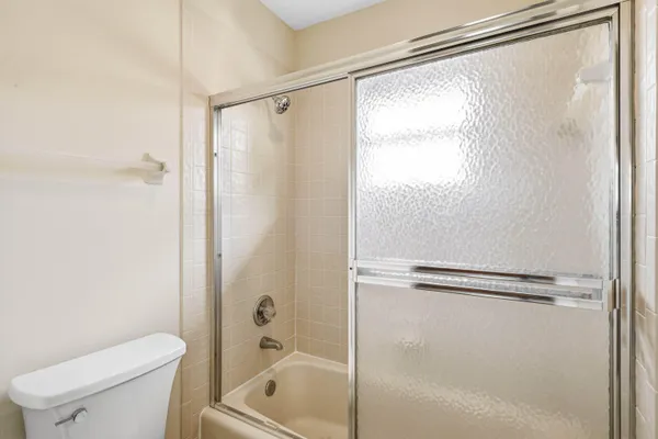 a spacious bathroom with a double vanity sink and a mirror