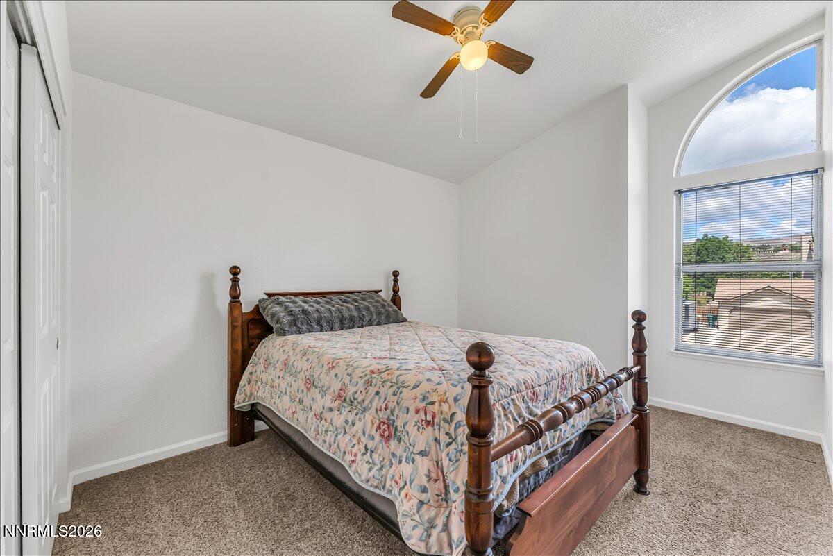 10 Eagle Claw Court Reno, NV 89523 - Photo 26 of 36 a bed sitting in a bedroom next to a window