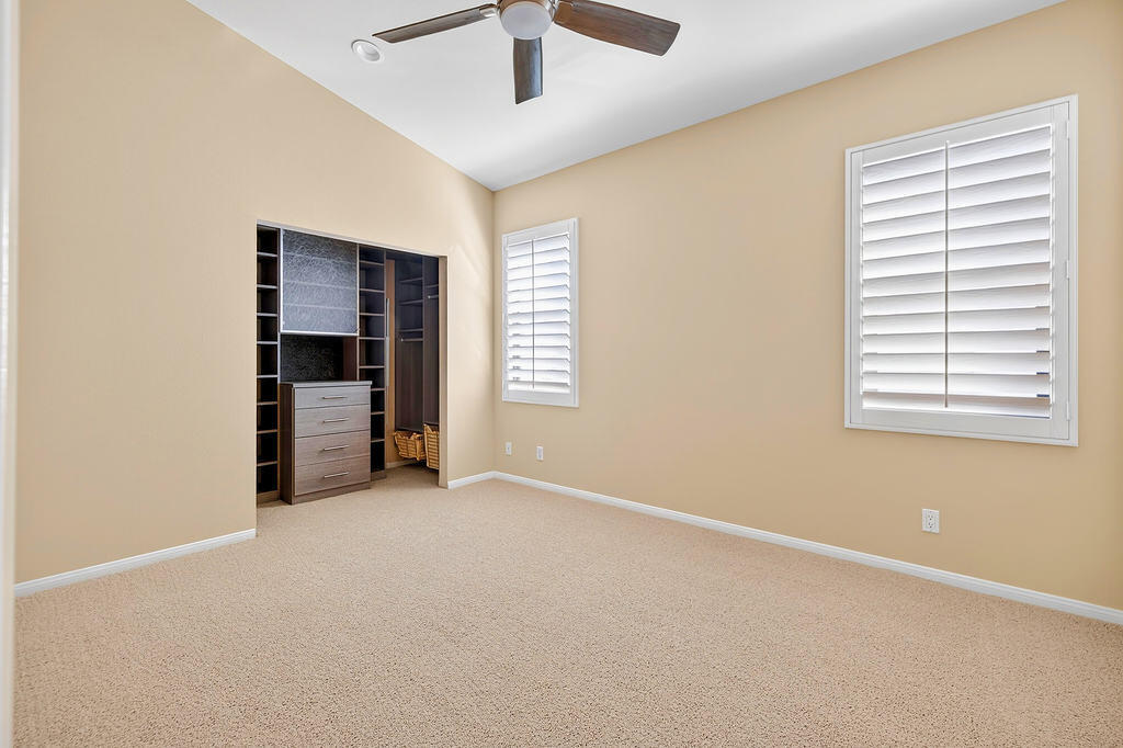 38019 Crocus Lane Palm Desert, CA 92211 - Photo 13 of 28 an empty room with closet and windows