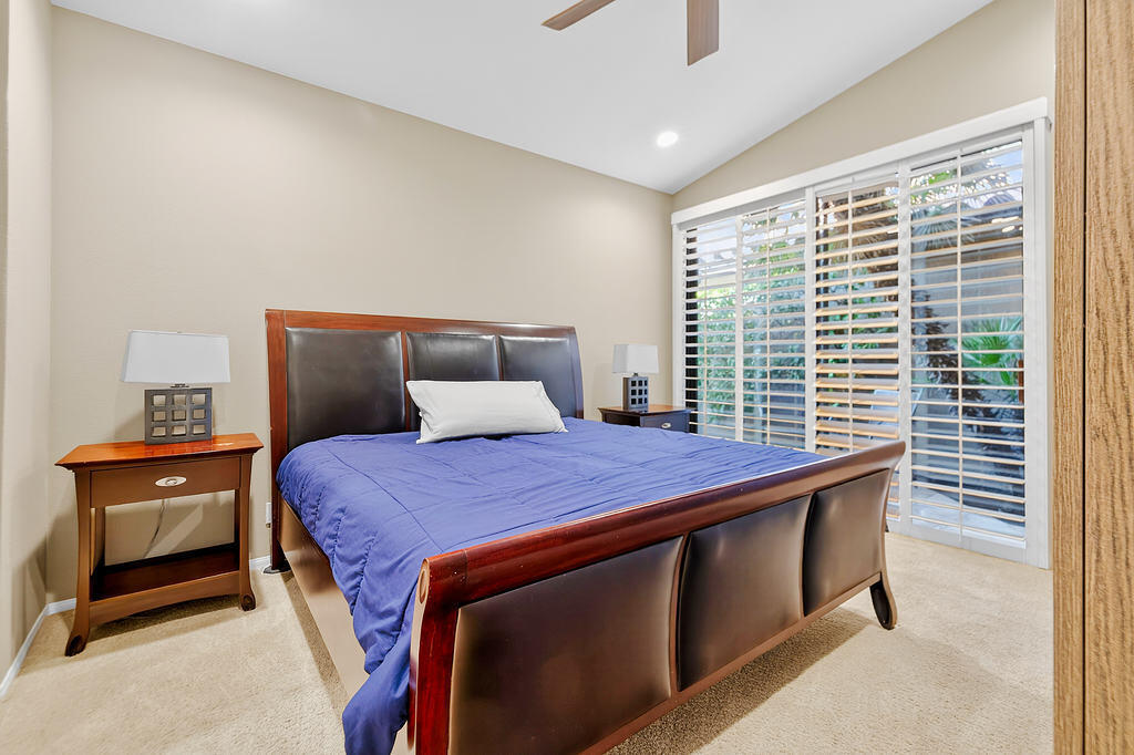 38019 Crocus Lane Palm Desert, CA 92211 - Photo 14 of 28 a bedroom with a bed and a window